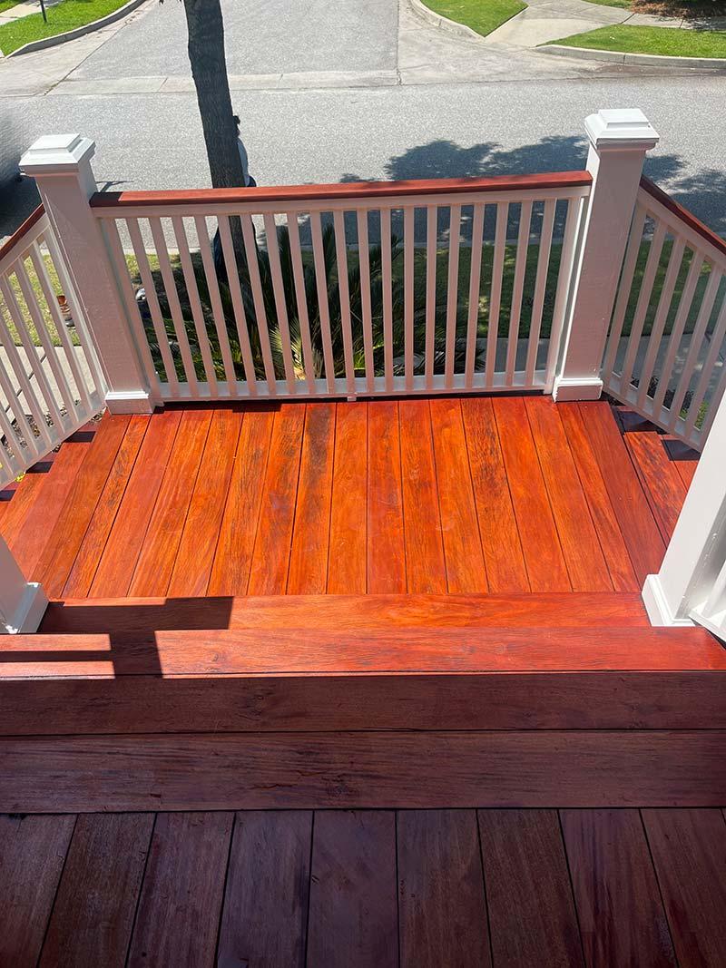 Freshly stained backyard deck and railings by Daniel Island Decks, Doors, Floors & More