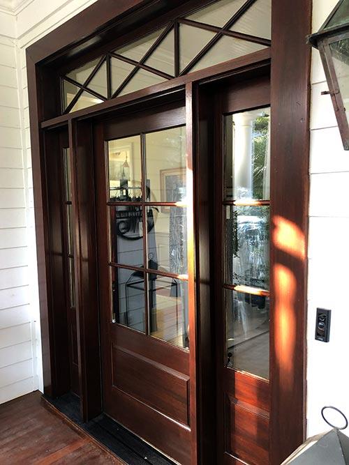 Refinished mahogany front door with a rich, protective gloss finish